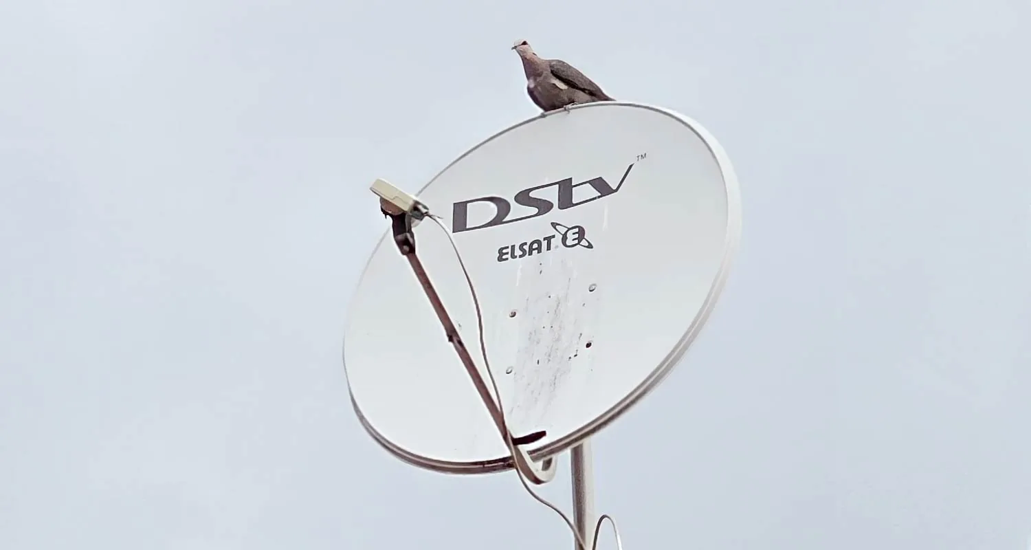 Newly installed satellite dish against a blue sky