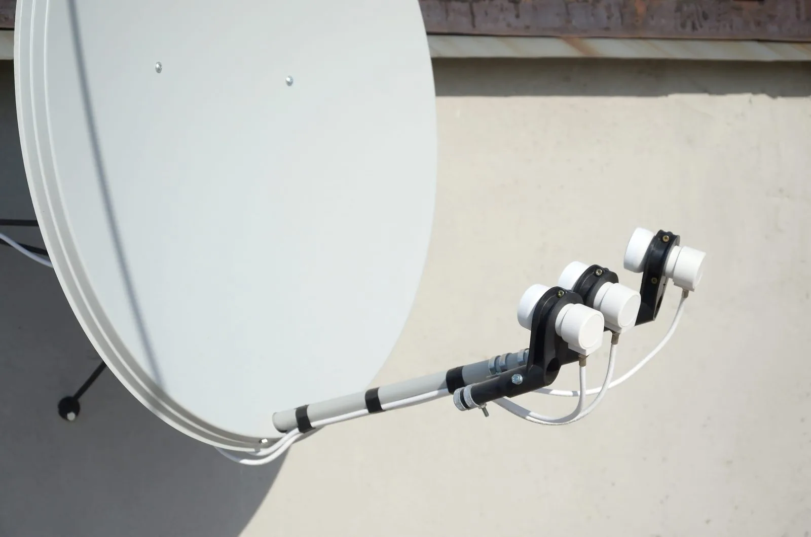 Satellite dish with triple LNB under repair